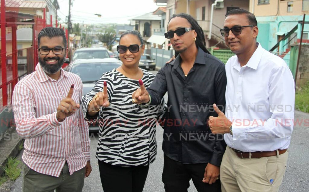 UNC candidate for Marabella  West, John Michael Alibocus and sister Faye Alibocus  after voting at the Anstey Memorial Girls Anglican school in San Fernando in the Local Government elections on Monday, joined by MP Saddam Hosein and MP Ravi Ratiram  - Lincoln Holder