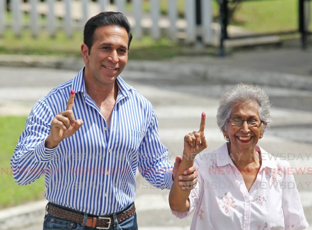 Local Government minister Faris Al Rawi and his mother Diane Seukrran cast their vote at the San Fernando West secondary school  in the LOcal Government elections on Monday  - Lincoln Holder