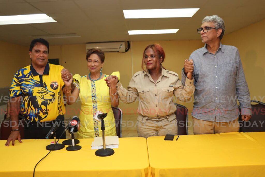 From left, Oropouche East MP Roodal Moonilal, UNC Political Leader Kamla Persad-Bissessar, Senator Jearlean John and UNC local government election campaign manager Feeroze Khan, celebrate the party’s success at its  headquarters in Chaguanas on Monday night.  - ANGELO MARCELLE