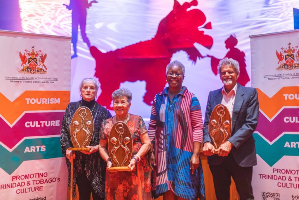 Culture Ministry permanent secretary Jasmin Pascal, second from left, with cultural mentors, from left, Helen Camps, Maria Lee and Shastri Maharaj at an award ceremony at Queen's Hall, St Ann's, Port of Spain on Wednesday. - MINISTRY OF CULTURE