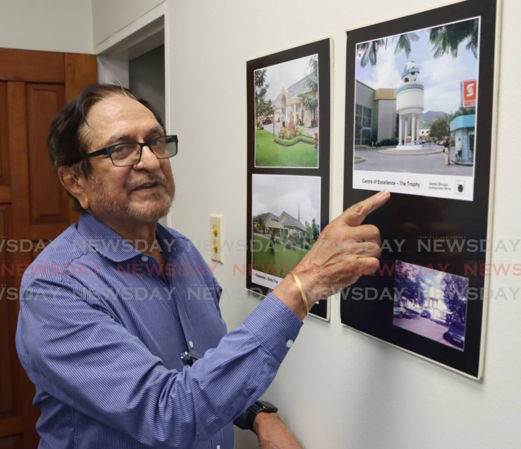 Architect Jaspal Bhogal shows a photo of Centre of Excellence in Macoya which he designed.  - Angelo Marcelle