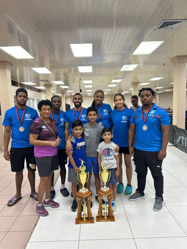 Some of the players who competed at a high level at the TT Table Tennis Association National Championships at the Centre of Excellence, Macoya. Abraham Francis, from left, Merle Baggoo, Derron Douglas, Yuvraaj Dookram, Imani Edwards-Taylor, Jordan Thang and Joshua Maxwell. The youngsters in front are three promising players from Queen's Park. - 