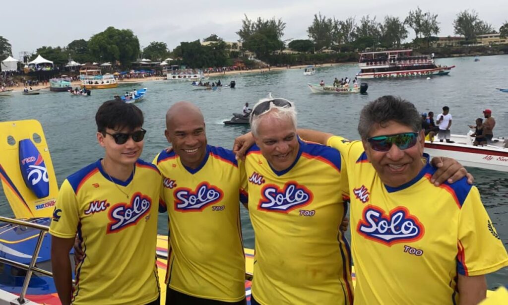 Mr Solo crew celebrating completing the Great Race at Store Bay, Tobago, Saturday.  - Ronald Daniel 