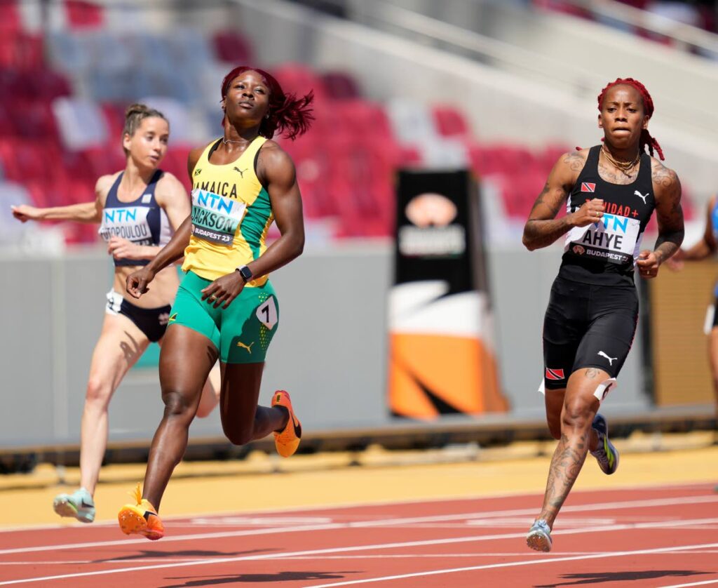 Shericka Jackson, of Jamaica, second from left, wins her women's 100m heat at the World Championships in Budapest, Hungary, Sunday. - AP