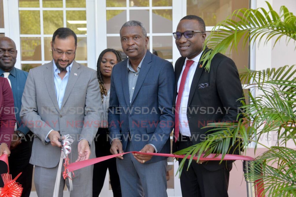From left, MP for Port of Spain North/St Ann's West Stuart Young, Minister of Digital Tranformation Hassel Bacchus and acting permanent secretary in the Ministry of Community Development David Roberts cut the ribbon at the opening of the Cascade Community Centre, Cascade Main Road, Port of Spain, on Monday.   - Anisto Alves