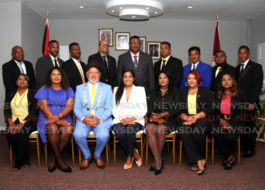 Chairman of the Couva/Tabaquite/Talparo Regional Corporation Henry Awong, third from left, takes a photo with CTTRC CEO Hinni Maraj and councillors of the Couva/Tabaquite/Talparo Regional Corporation during the swearing-in ceremony at Railway Road, Couva. - AYANNA KINSALE