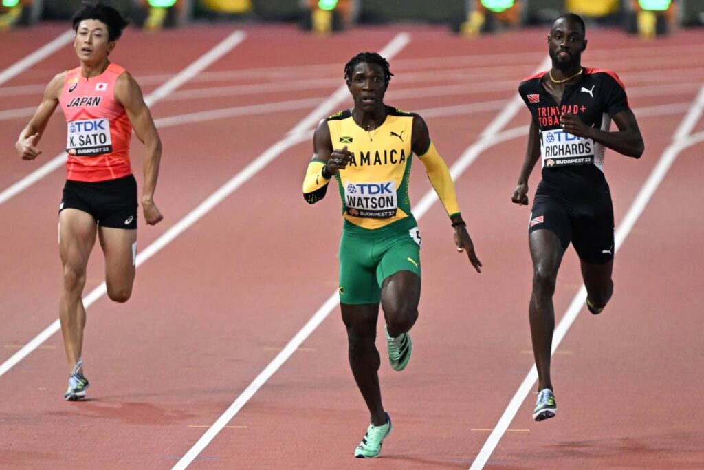 Jamaica's Antonio Watson, centre, wins men's 400m semifinal one as Trinidad and Tobago's Jereem Richards, right, and Japan's Kentaro Sato trail in the World Athletics Championships at the National Athletics Centre in Budapest on Tuesday. - AFP