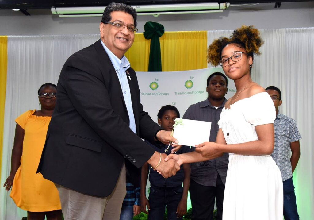 MP for Mayaro Rushton Paray congratulates Charisma Granthume who was the top performer for her cohort in the BPTT-sponsored computer coding camp held at the Mayaro Resource Centre. - 