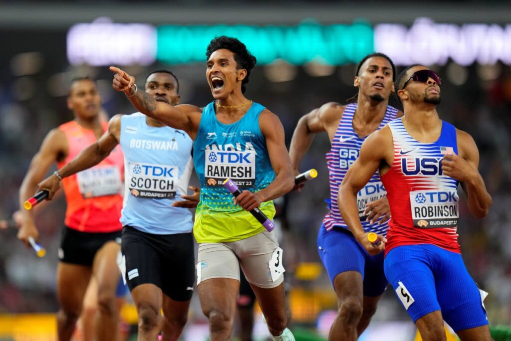 Rajesh Ramesh, of India celebrates after placing second behind Justin Robinson, of the United States in a men's 4x400m relay heat during the World Athletics Championships in Budapest, Hungary, Saturday. - AP