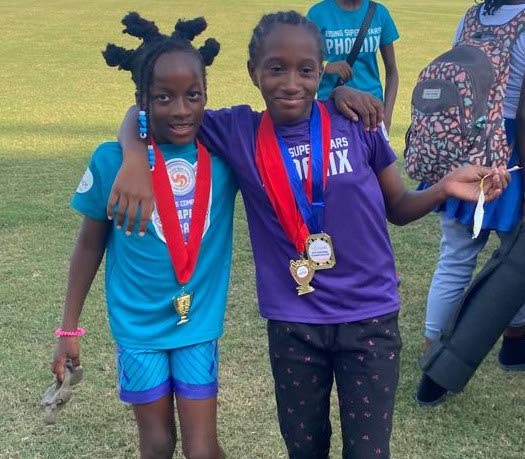 RSS Phoenix athletes Gloria Henry, right, and Kyoni Morris. - 