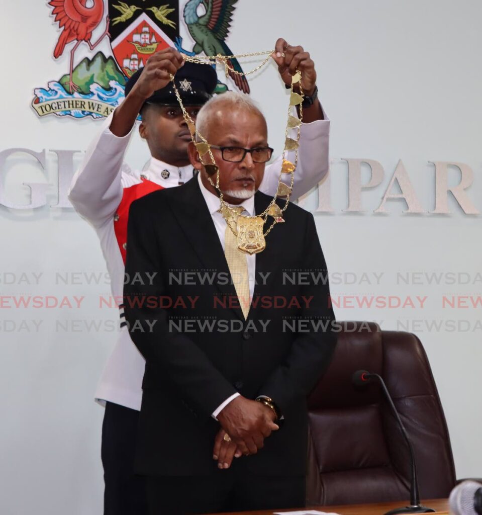 Councillor for Avocat/San Francique North Doodnath Mayrhoo is endowed with a civic regalia as he is appointed mayor of the new Siparia borough during a swearing-in ceremony at the Siparia Borough Corporation on Wednesday. - Angelo Marcelle