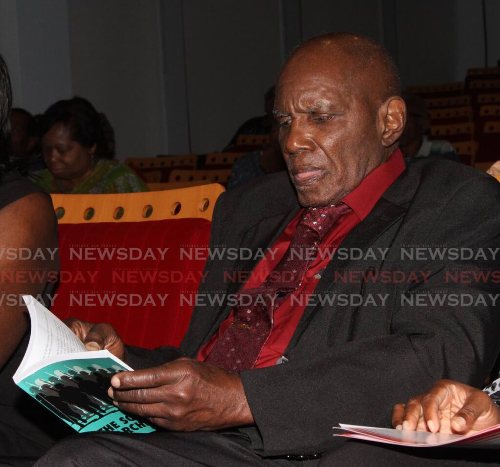 In this 2020 file photo, author Michael Anthony reads from one of his book, The Sound of Marching Feet, at Nalis, Port of Spain. - ANGELO_MARCELLE
