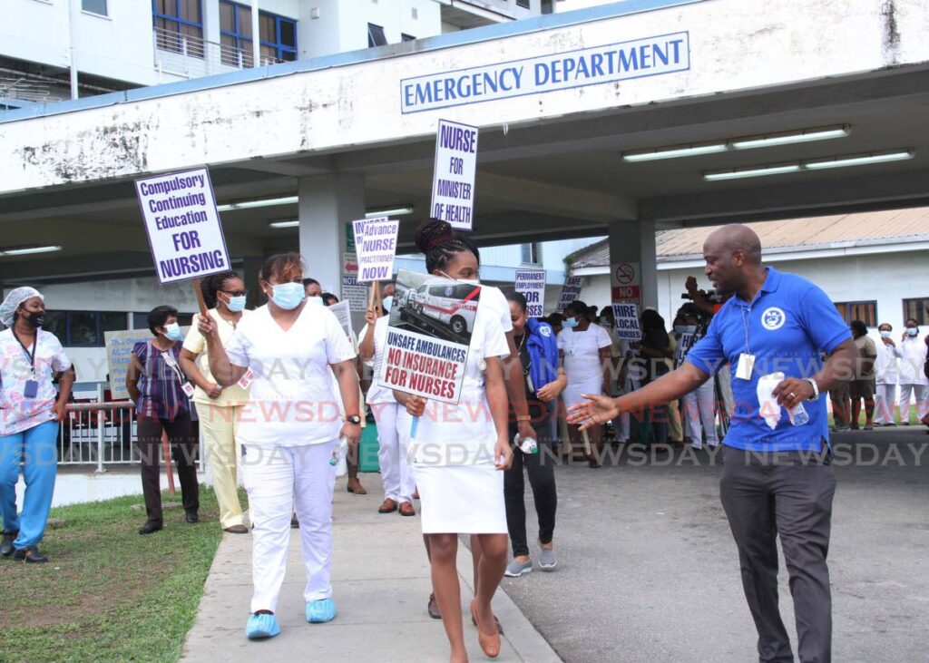 A 2020 file photo shows TT Registered Nurses' Association president Idi Stuart with protesting nurses in San Fernando. - 
