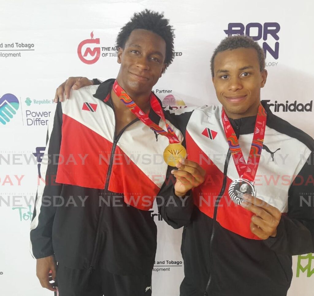 TT's Nikoli Blackman (L) and Zarek Wilson display their medals after competing, on Monday, at the 2023 Commonwealth Youth Games, at the National Aquatic Centre, Couva. - Photo by Jonathan Ramnanansingh