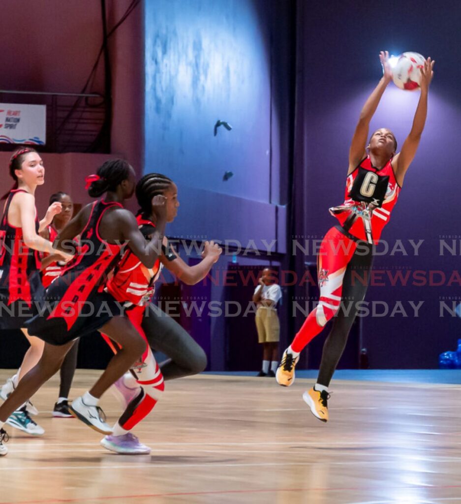 A Trinidad and Tobago player jumps to collect a pass during a Fast5 Netball match against Canada in the Commonwealth Youth Games, at Shaw Park Cultural Complex indoor court, Tuesday. Photo by David Reid