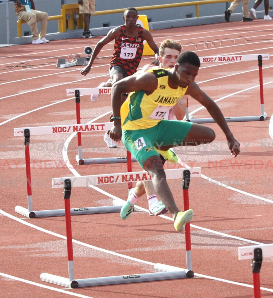 Jamaica's Daneil Wright jumps over the hurdle in the men's 400m hurdles at the 2023 Commonwealth Youth Games at the Hasley Crawford Stadium. 
