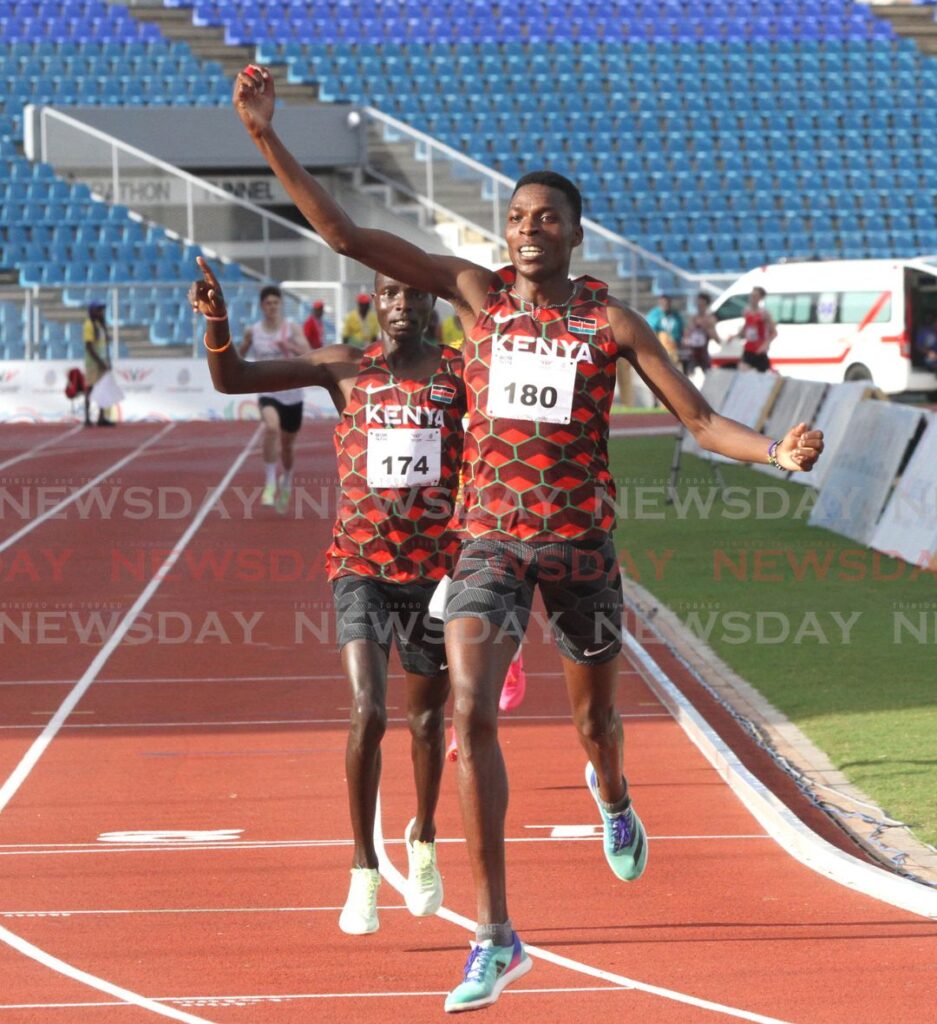 Kenya's Jospat Sang Kipkirui makes his way across the finishing line in the men's 1500m run at the 2023 Commonwealth Youth Games at the Hasley Crawford Stadium. In second place is Kenya's Andrew Kiptoo Alamisi. - Photo by Ayanna Kinsale