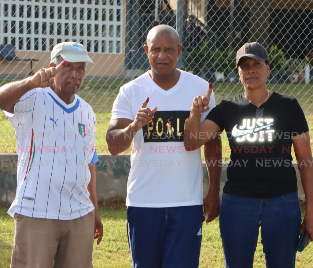 UNC Valencia candidate Neil De Silva and his family after voting at the Valencia Government School on Monday. - Photo by Angelo Marcelle