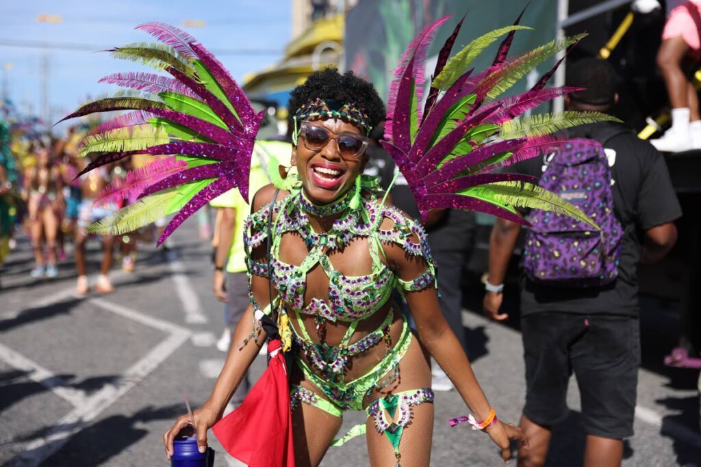 Paparazzi  masquerader crosses the stage at  South Quay,Port of Spain, on February 21, 2023. - JEFF K. MAYERS