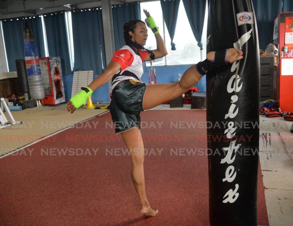 Rebecca Bhola demonstrates a round house kick at the Tazmanian Bulldogs School of Martial Arts and Kickboxing on Mission Road, Freeport.  - Anisto Alves