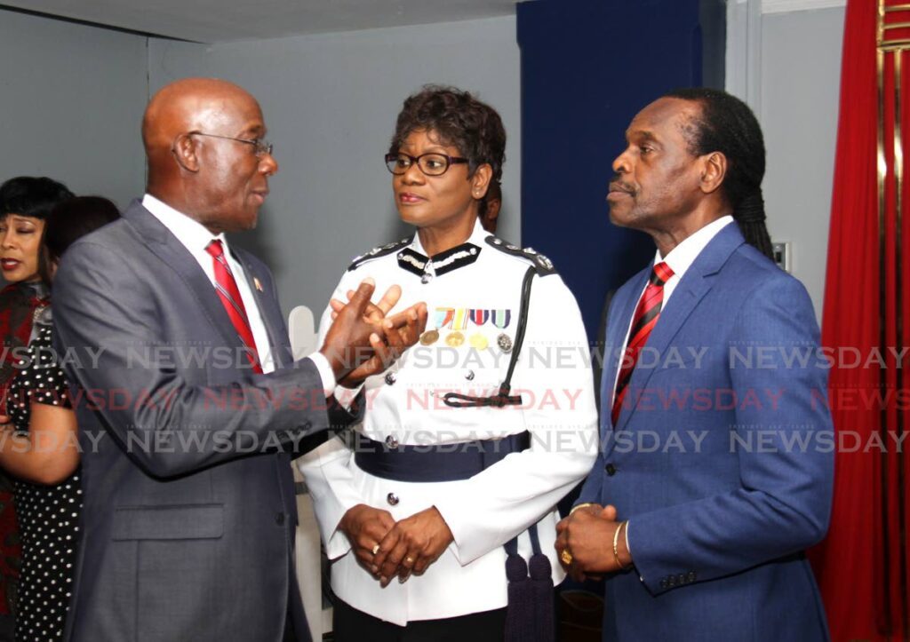 Prime Minister Dr Keith Rowley, left, with Police Commissioner Erla Harewood-Christopher and National Security Minister Fitzgerald Hinds. - 