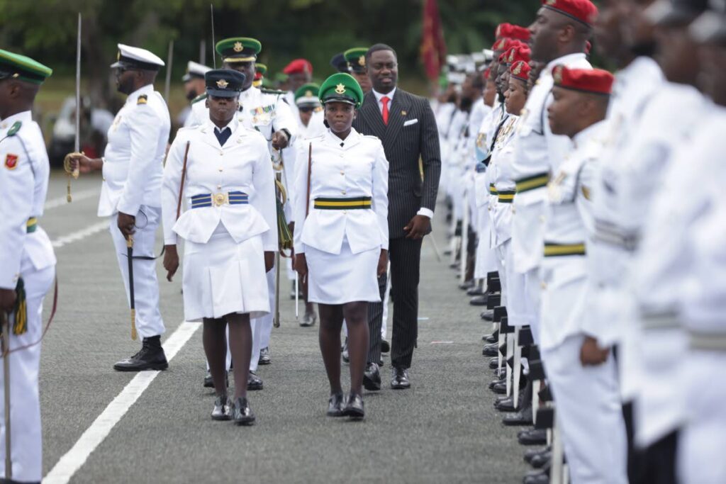 THA Chief Secretary Farley Augustine inspects officers at Tobago's Independence Day parade at the Dwight Yorke Stadium, Bacolet, Tobago on Thursday. PHOTO COURTESY THA - 