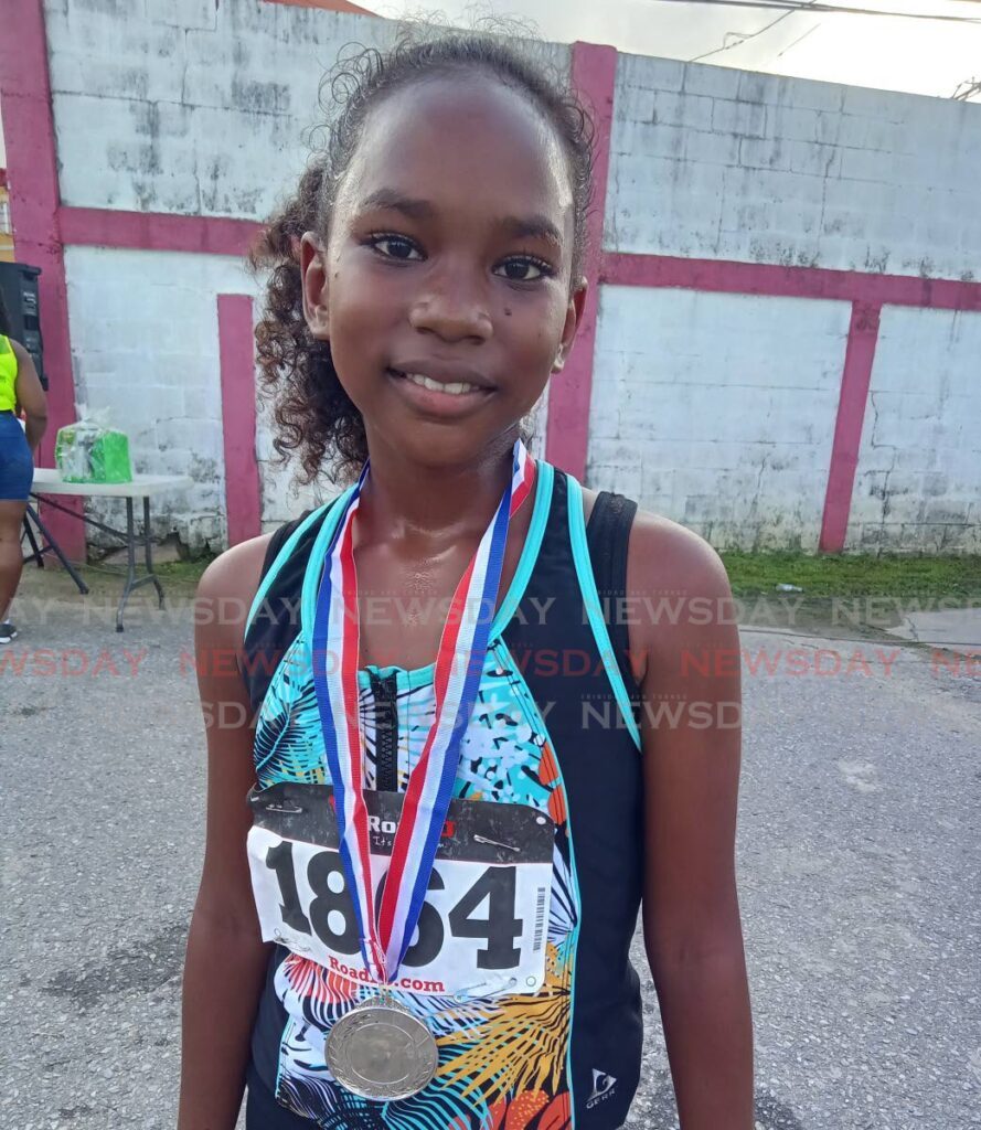 Chennai Moore after winning the women's category in the annual Sweaters 5K Fun Run/Walk in Sangre Grande in June. - Stephon Nicholas