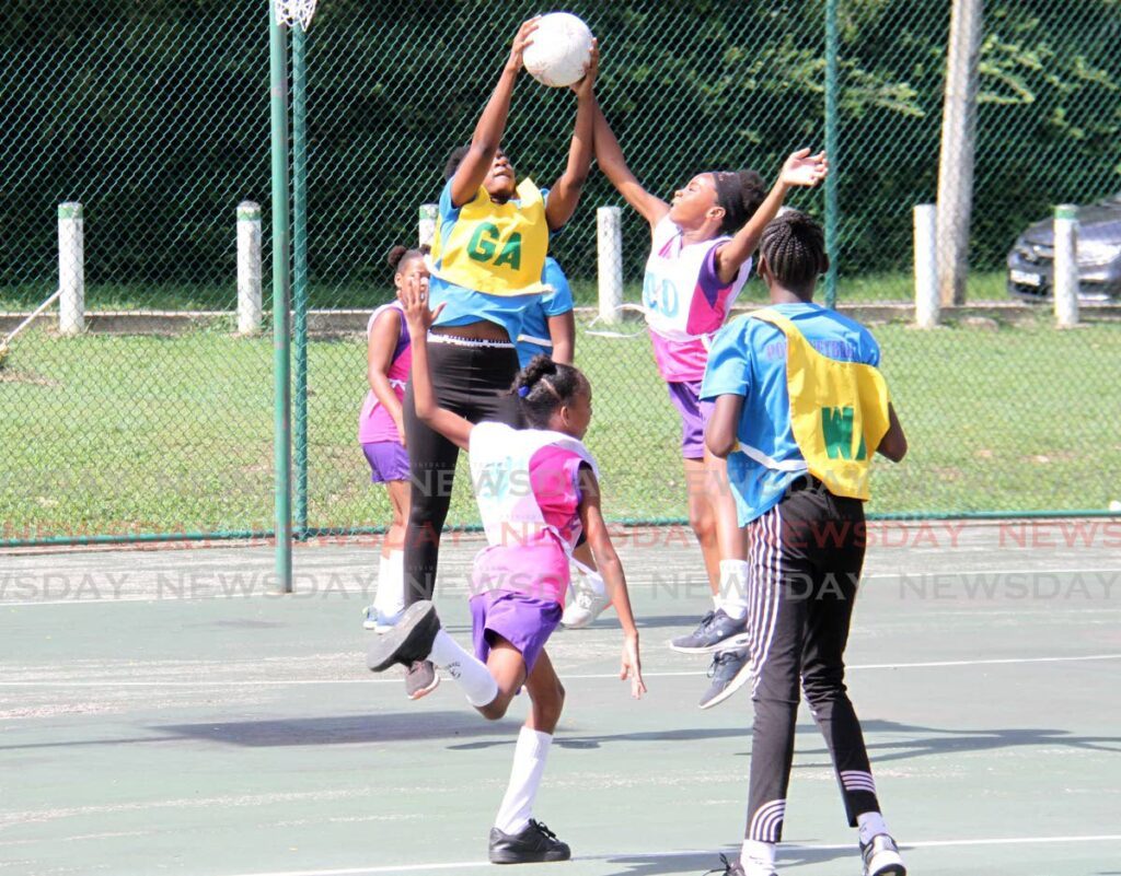 Police Netball Youth Club goal attack Jamelia Abraham, left, and Transcend United goal defence Seriah Colies go for the ball during the Republic Bank Laventille Netball League at the Lystra Lewis courts, Nelson Mandela Park, St Clair, Saturday. - Ayanna Kinsale