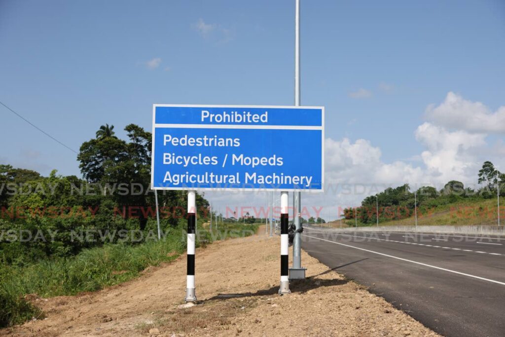 A sign on the newly opened San Fernando to Point Fortin Highway reminds the public that pedestrians, bicycles, mopeds and agricultural machinery are prohibited on the thoroughfare. - Jeff K. Mayers