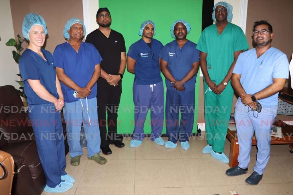 The cochlear implant team at the St Augustine Private Hospital,. From the left, Jennifer Kryszak of MED-EL, Dr Solaiman Juman, ENT surgeon Josh Jurawan, Jibran Juman, Professor Howard Francis, ENT resident Marlon Christopher and senior ENT resident Richard Koonoolall.  - Photo by Angelo Marcelle