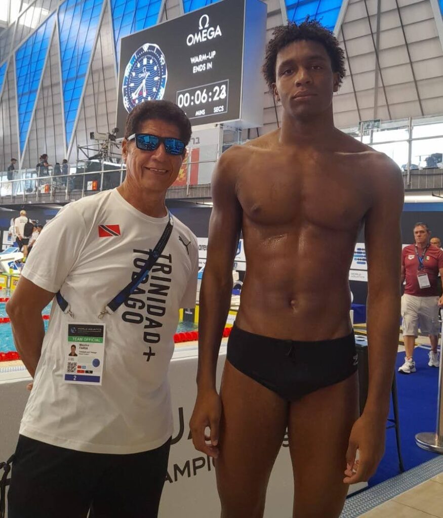 TT swimmer Nikoli Blackman with national coach Maurice Faria at the Wingate Institute Olympic pool, Netanya, Israel, Wednesday.  - 