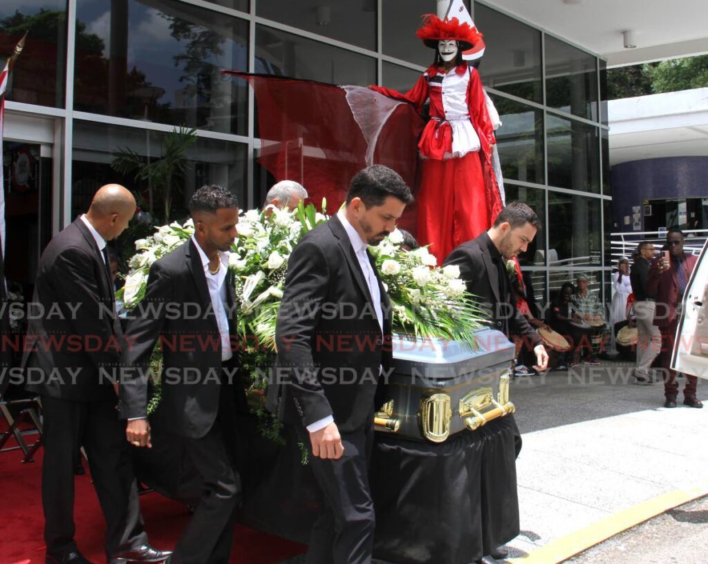 Pallbearers, including Denyse Plummer's two sons, Jesse and Robert Boocock, carry her coffin after a memorial service for the calypso queen at Queen's Hall, St Anns, on Wednesday. - Ayanna Kinsale