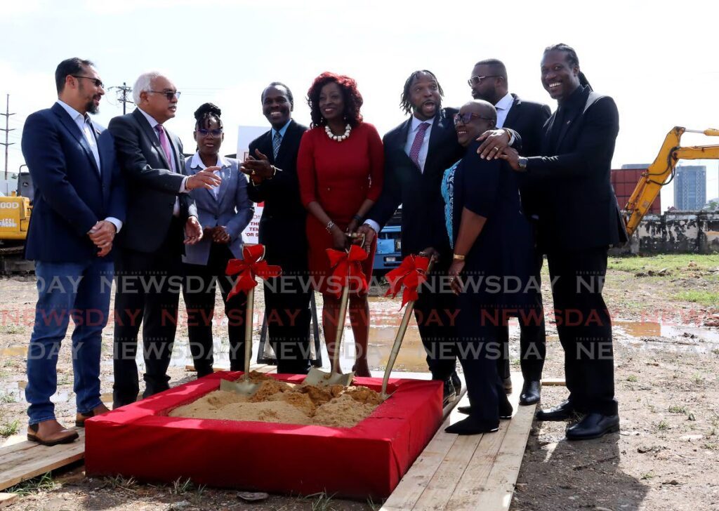 Minister of Social Development Donna Cox, centre, and other government officials turn the sod for a new homeless centre at South Quay, Port of Spain, on Wednesday. The five-storey building will house 200 homeless people and will cost $50 million. - ROGER JACOB