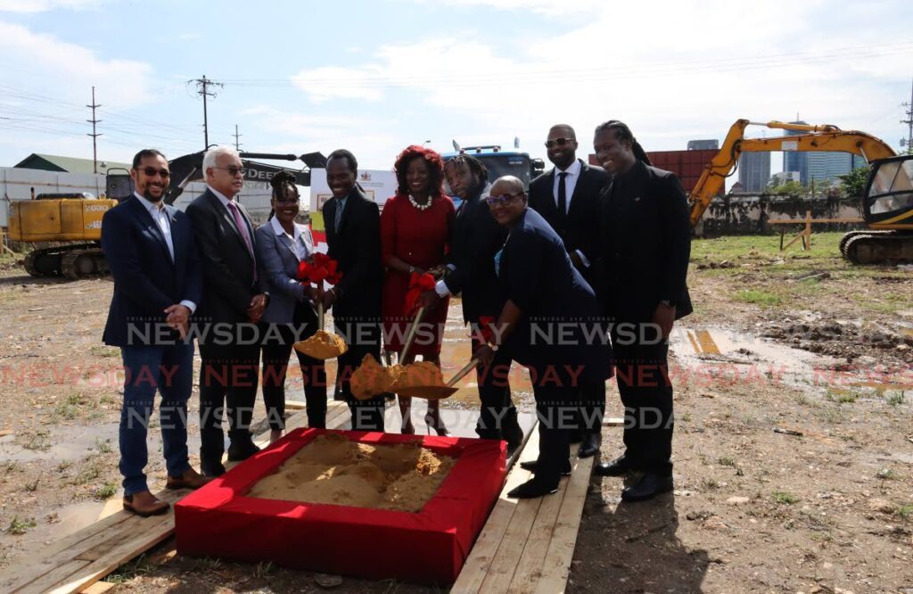 Social Development Minister Donna Cox, centre, and other government officials turn the sod for the new homeless cenrtre at South Quay, Port of Spain. - ROGER JACOB