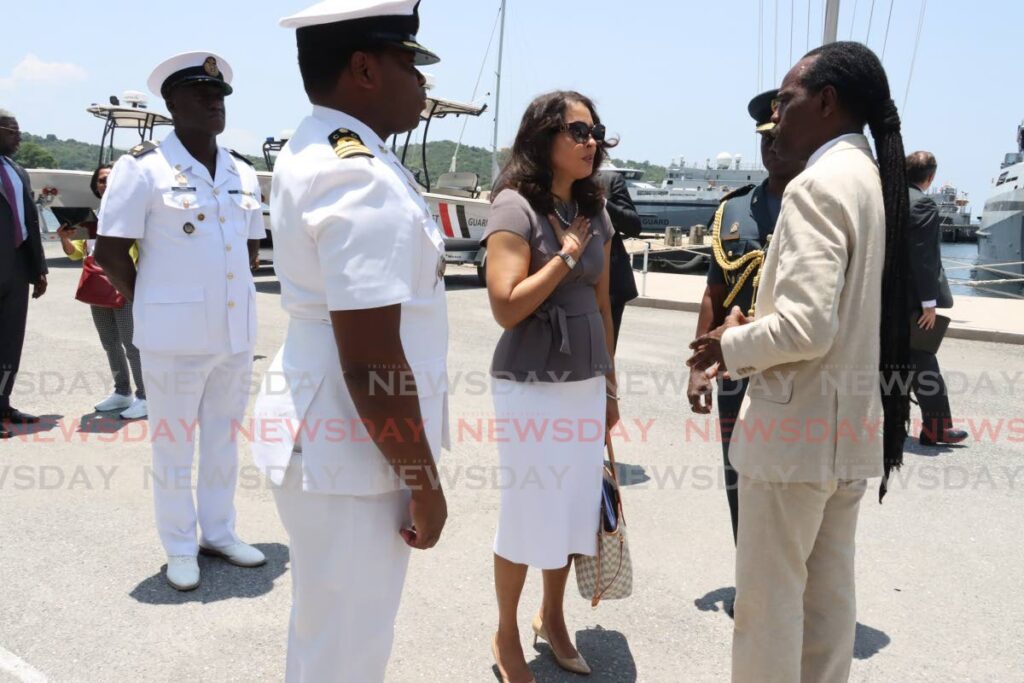 US Ambassador to TT Candace Bond speaks with National Security Minister Fitzgerald Hinds alongside  Chief of Defence Staff Air Vice Marshall Darryl Daniel and Commanding Officer of TTCG Commander Akenethon Isaac. Bond presented marine equipment valued at 1.2 millon US to the TT Coast Guard at Staubles Bay Chaguaramas in September. - Photo by Roger Jacob