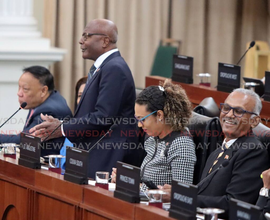 Couva South MP Rudranath Indarsingh, right, and St Augustine MP Khadijah Ameen laugh during the contribution of Naparima MP Rodney Charles, during a sitting of the House of Representatives, Red House, Port of Spain, on Friday.  - Angelo Marcelle
