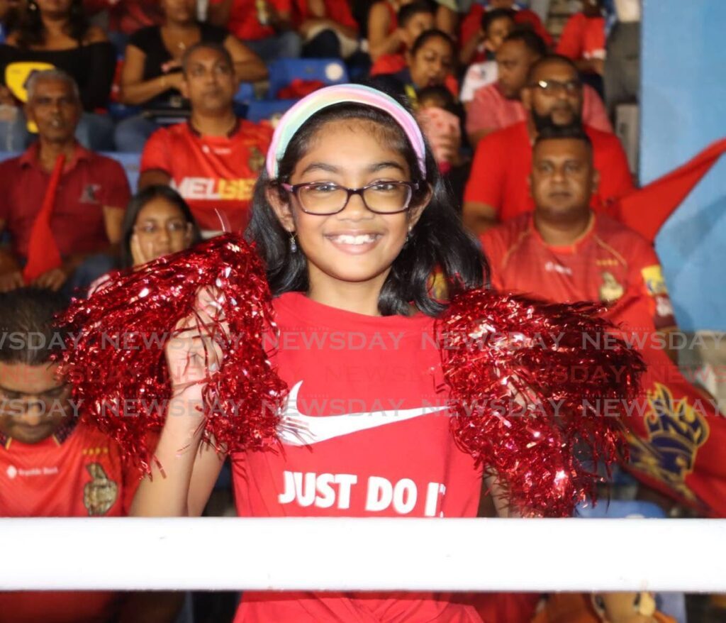 A young Trinbago Knight Riders fan cheers her team at the Queen's Park Oval, Port of Spain. - ANGELO MARCELLE