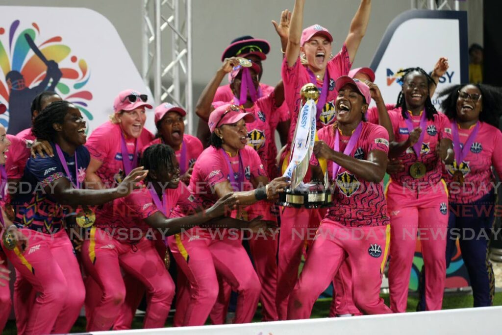 Barbados Royals women lift the Massy Women's CPL trophy on Sunday at the Brian Lara Cricket Academy, Tarouba.  - Lincoln Holder