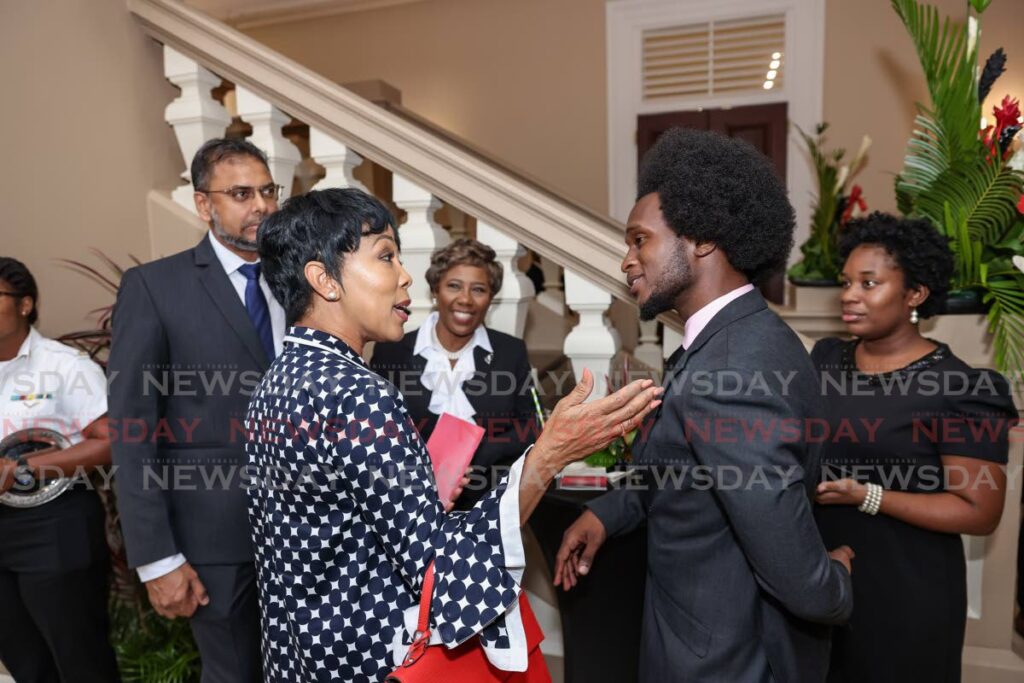 New Independent Senator Helon Francis, calypsonian, second from right, speaks with the Prime Minister's wife, Sharon Rowley, at the Red House Rotunda after the ceremonial opening of the Fourth session of the 12th Parliament, Port of Spain - Photo by Jeff K. Mayers