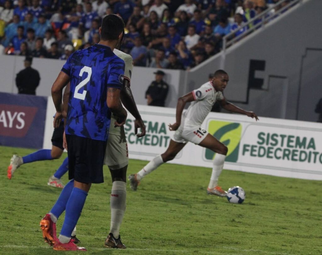 TT forward Reon Moore, right, on the attack against El Salvador in a Concacaf Nations League match on Sunday in El Salvador.  - TTFA Media 