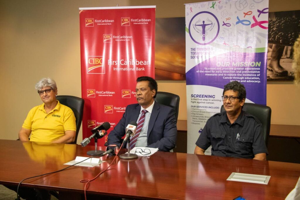 CIBC Walk for the Cure race organiser Andreas Stuven, left, talks to the media alongside Anthony Seeraj, managing director, CIBC First Caribbean, Trinidad market, centre, and Dr Kavi Capildeo, Cancer Society board member at a media conference on Wednesday in Port of Spain. - 