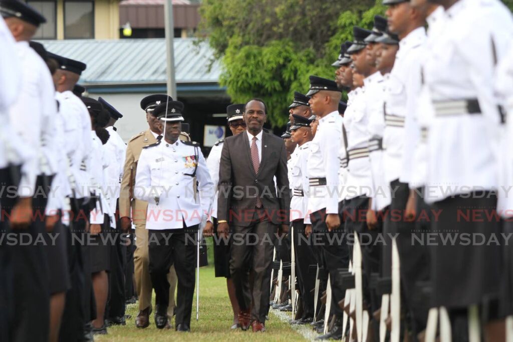 National Security Minister Fitzgerald Hinds inspects recruits on the parade square during the TTPS passing out parade at the Police Academy, St James Barracks on May 29. - Photo by Ayanna Kinsale