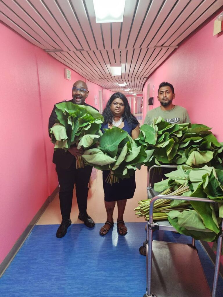 NCRHA staff members show off their produce.  - 