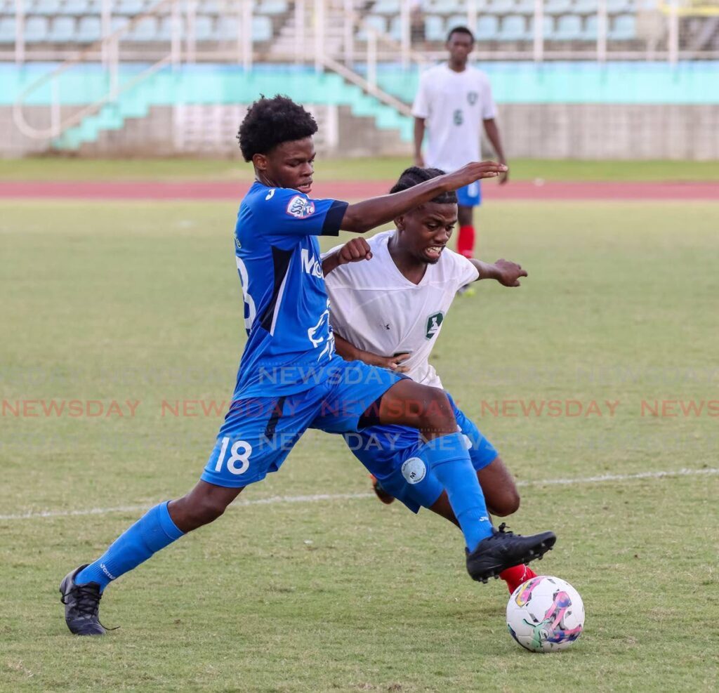 Presentation College's Maliq Brathwaite, left, battles his Malik rival for the ball in a SSFL match last Saturday at the Manny Ramjohn Stadium, Marabella. - Jeff K Mayers