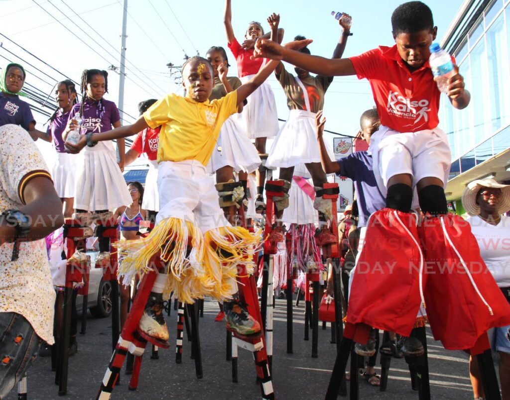 Kaiso Kah Valencia cultural group enjoy themselves during the Arima Borough Day celebrations on Queen Street, Arima.  - Ayanna Kinsale