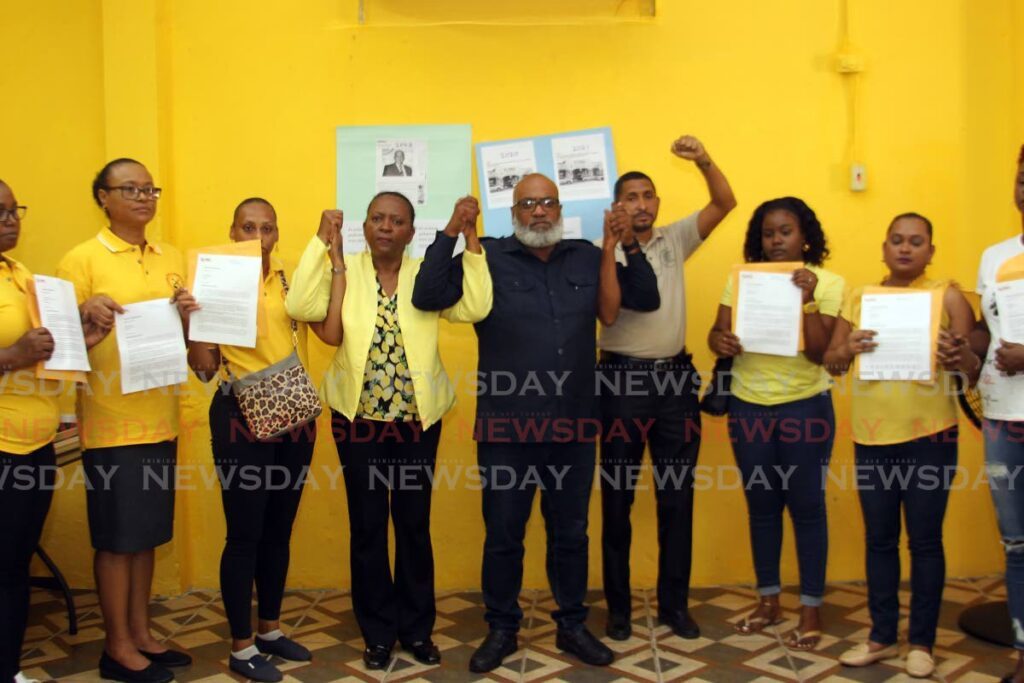 From left, retrenched Massy Stores workers Tamika Charles, Denise Marcelle, Cherish Gibson, joined by president of the Contract General Workers Trade Union (CGWTU) Ermine DeBique-Meade, secretary general of JTUM Ozzie Warwick, president of the Communication Workers Trade Union Clyde Elder, and Afiya Valentine, Nesha Rampersad and Leah Pascall, also retrenched by Massy Stores at a media conference CGWTU's office at Rushworth Street, San Fernando, on Monday. - Lincoln Holder