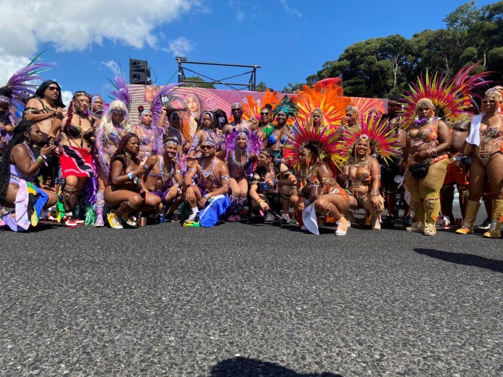 Some of the Masqueraders celebrating the inaugural Japan Caribbean Carnival pose for a group photo. - 