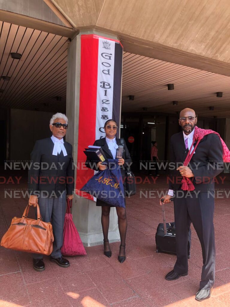 Defence attorneys Israel Khan, SC, Arissa Maharaj and Ulric Skerritt at the Hall of Justice, Port of Spain, on Tuesday. - Photo by Jada Loutoo