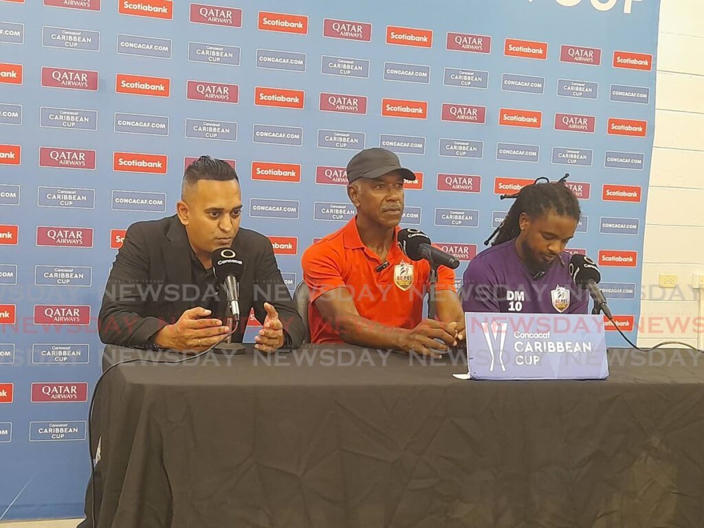 (Left to right) Concacaf media officer Shaun Fuentes, Athletic Club PoS coach Gilbert Bateau and midfielder Duane Muckette attend a press conference at the Hasely Crawford Stadium, Port of Spain. - Photo by Roneil Walcott