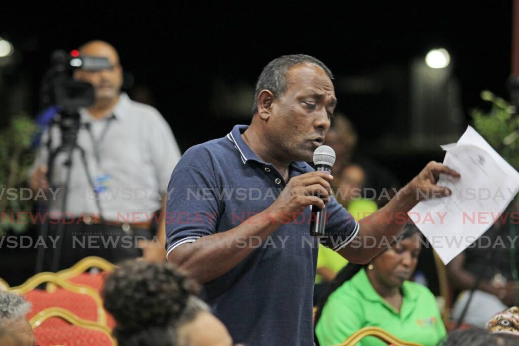 STUDENTS CAN'T READ: Paul Ramlogan a teacher at the Carapichaima West Secondary school asks a question at the education talk series on the education policy 2023-2027 at the Carapichaima West secondary school on Tuesday night. - Lincoln Holder